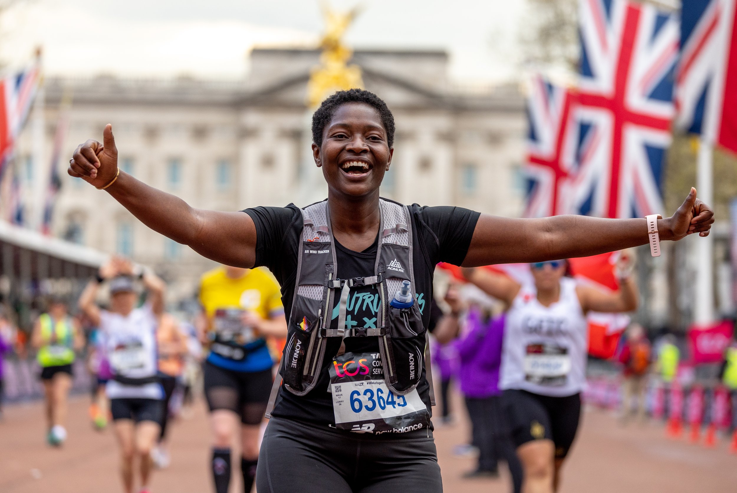 A runner smiling during the 2023 TCS London Marathon