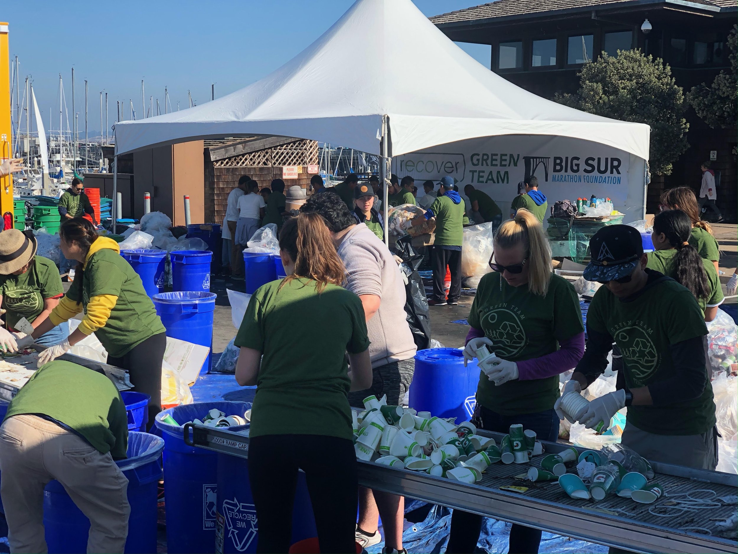 Green Team volunteers organized by Blue Strike Environmental sort waste for composting and recycling at the Big Sur Marathon.