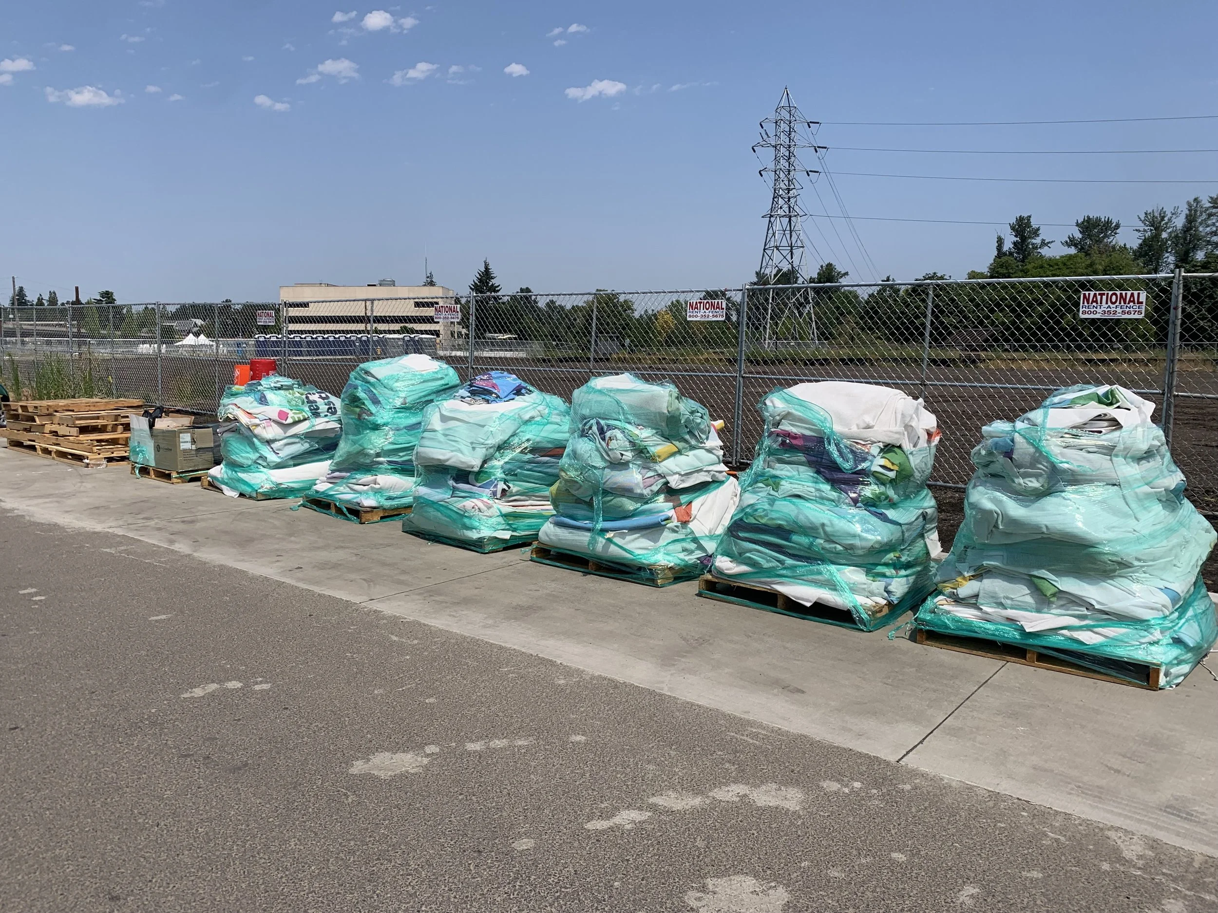 Pallets of reusable items at The Eugene RiverFront Festival