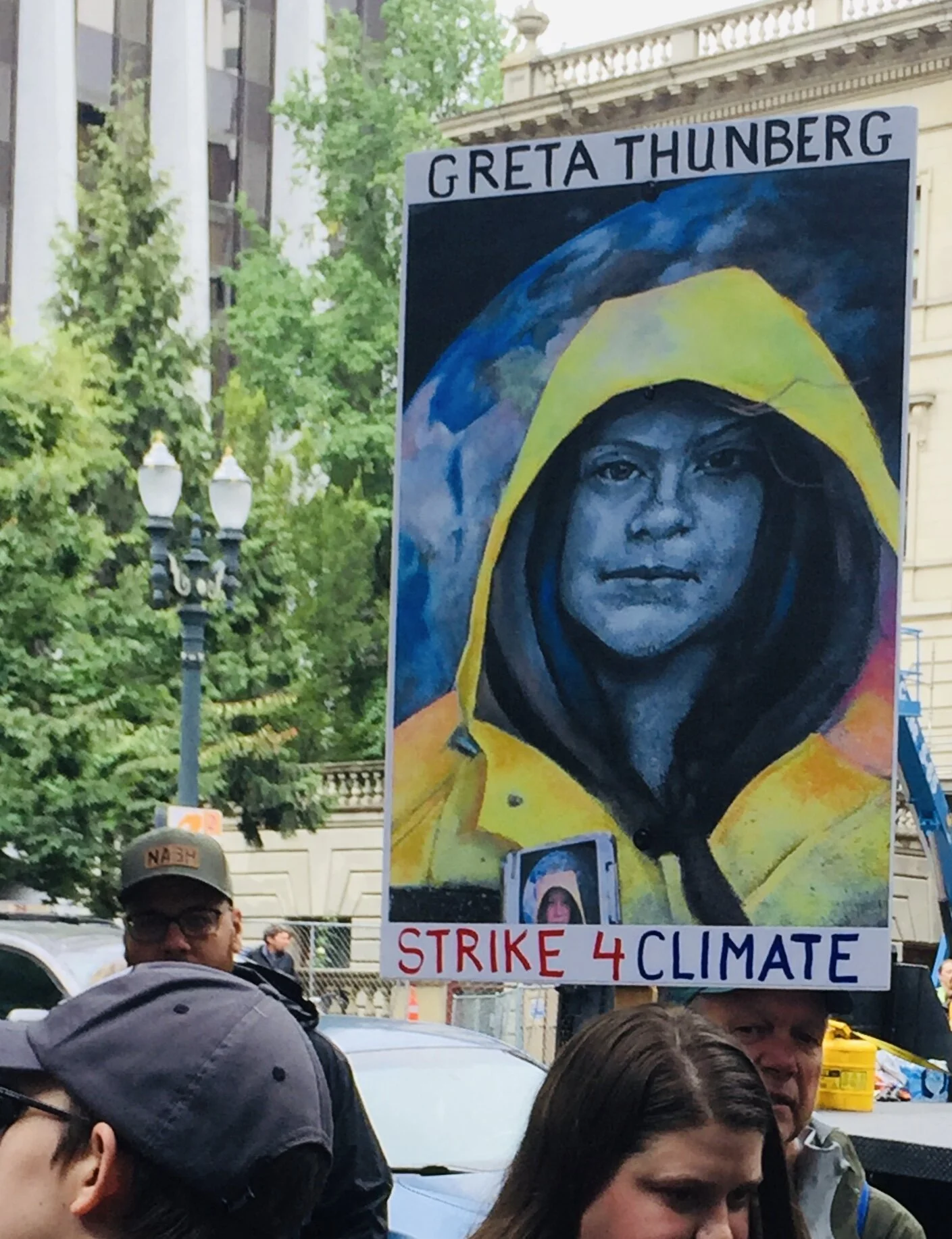 A hand-painted sign depicts 2019 Time Magazine Person of the Year, 16-year old Greta Thunberg, at a climate change demonstration in Portland, Oregon on September 20, 2019.