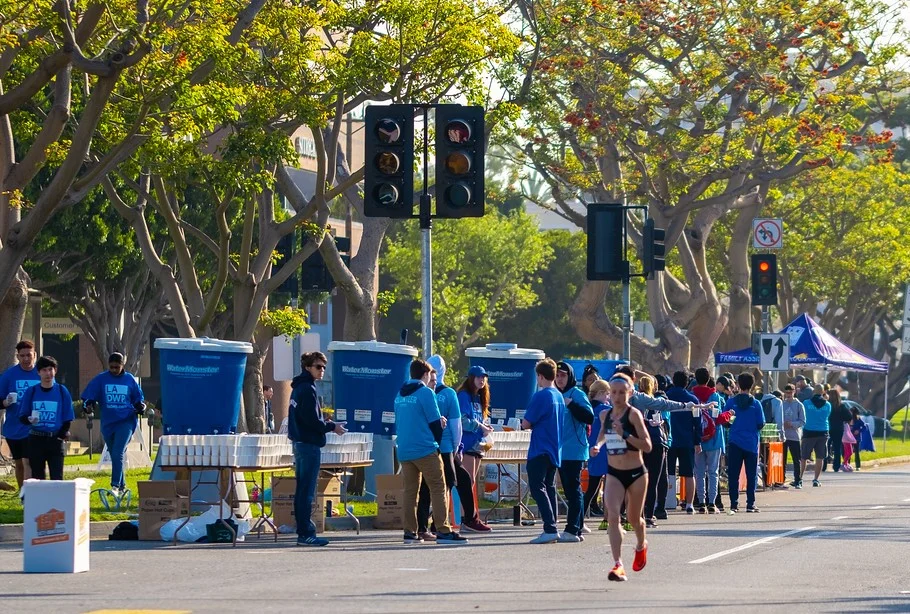 LA Marathon volunteers working at hydration stations