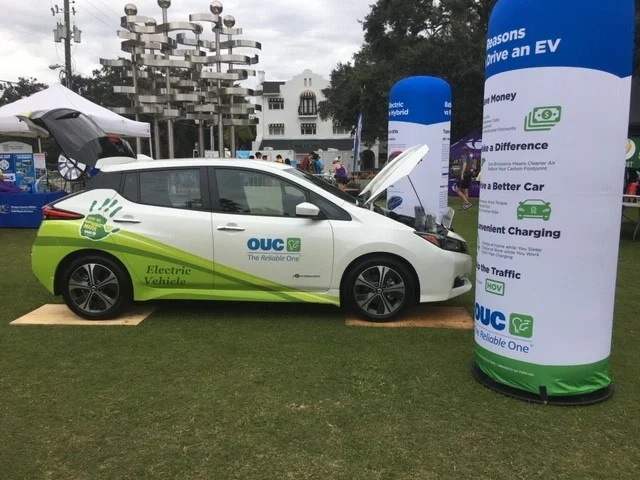 Title sponsor OUC The Reliable One setup an electric vehicle (EV) display at the 2018 Orlando Half Marathon to educate passerby about how they work.