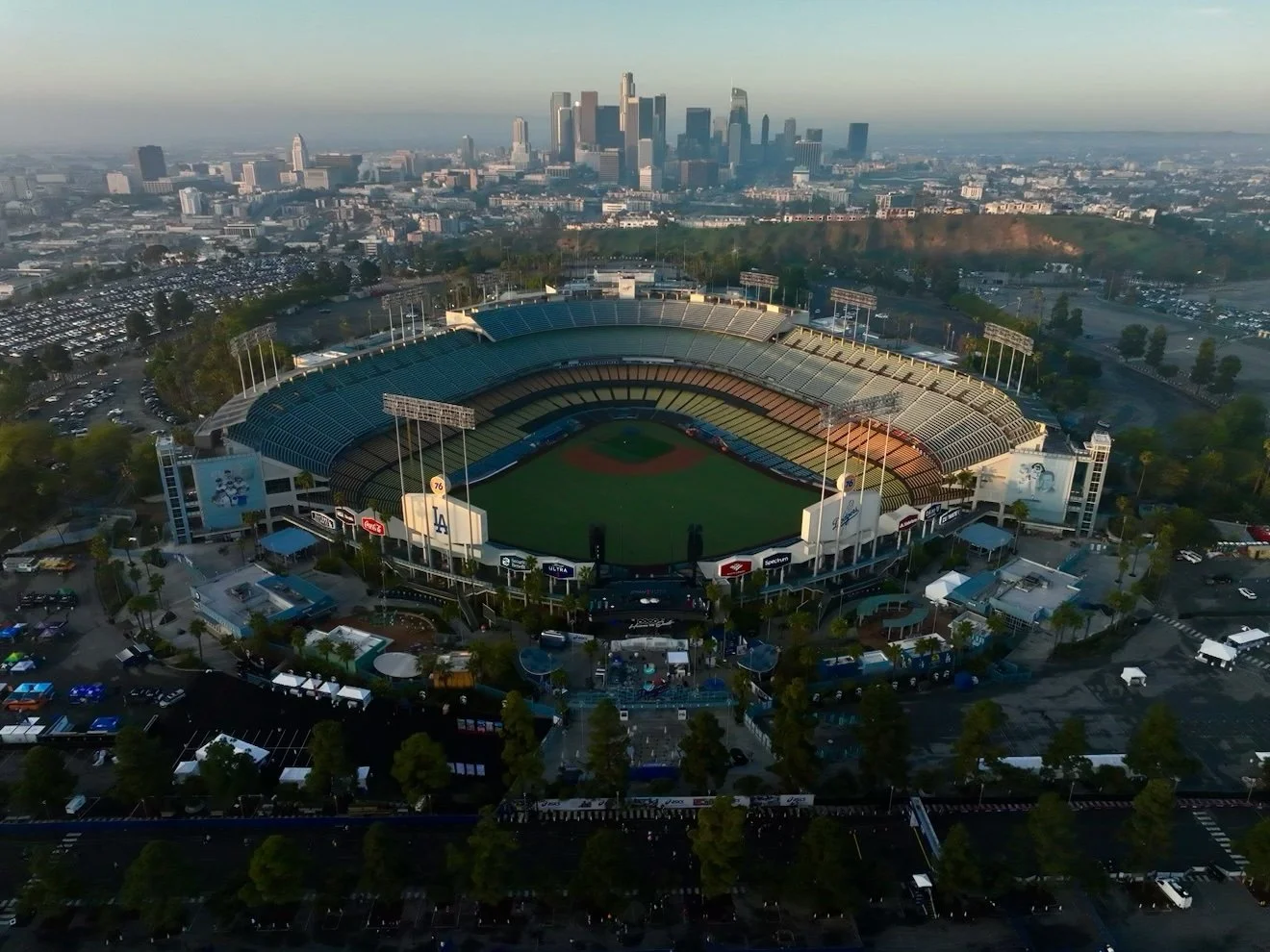 An aerial photo of the LA Dodgers stadium with the LA skyline in the background