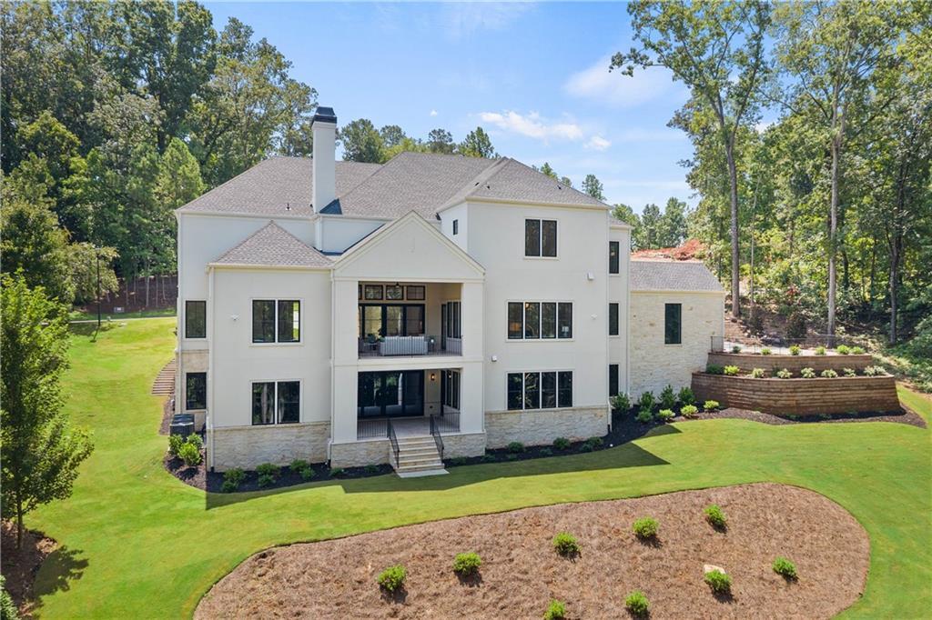 Rear exterior and covered porches of custom luxury home in Alpharetta, GA