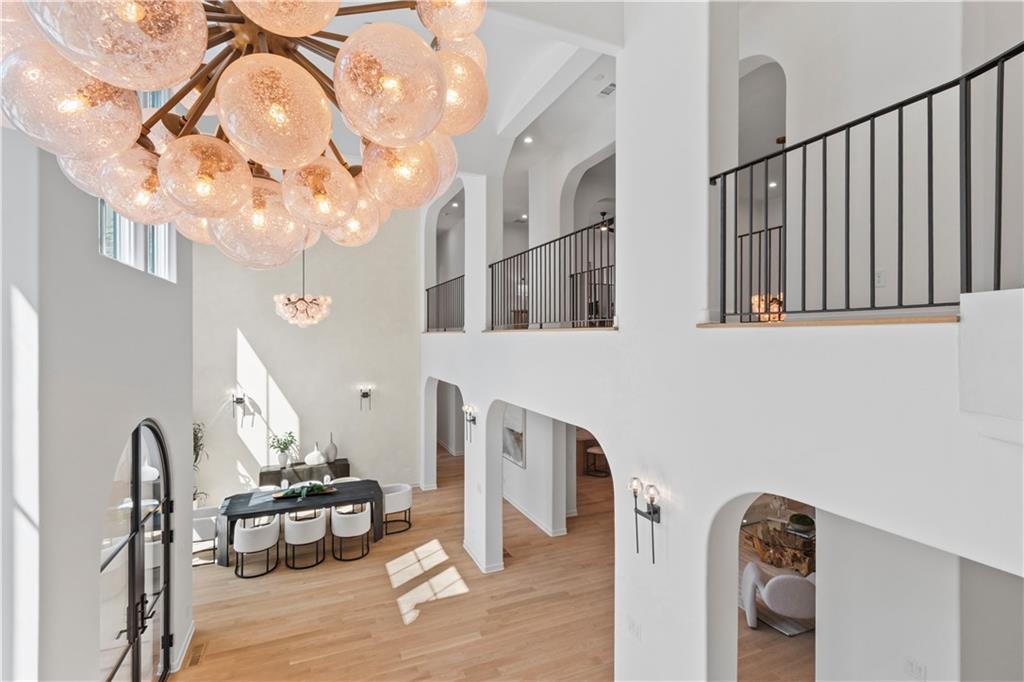 Upper level overlook above two-story foyer in custom estate home