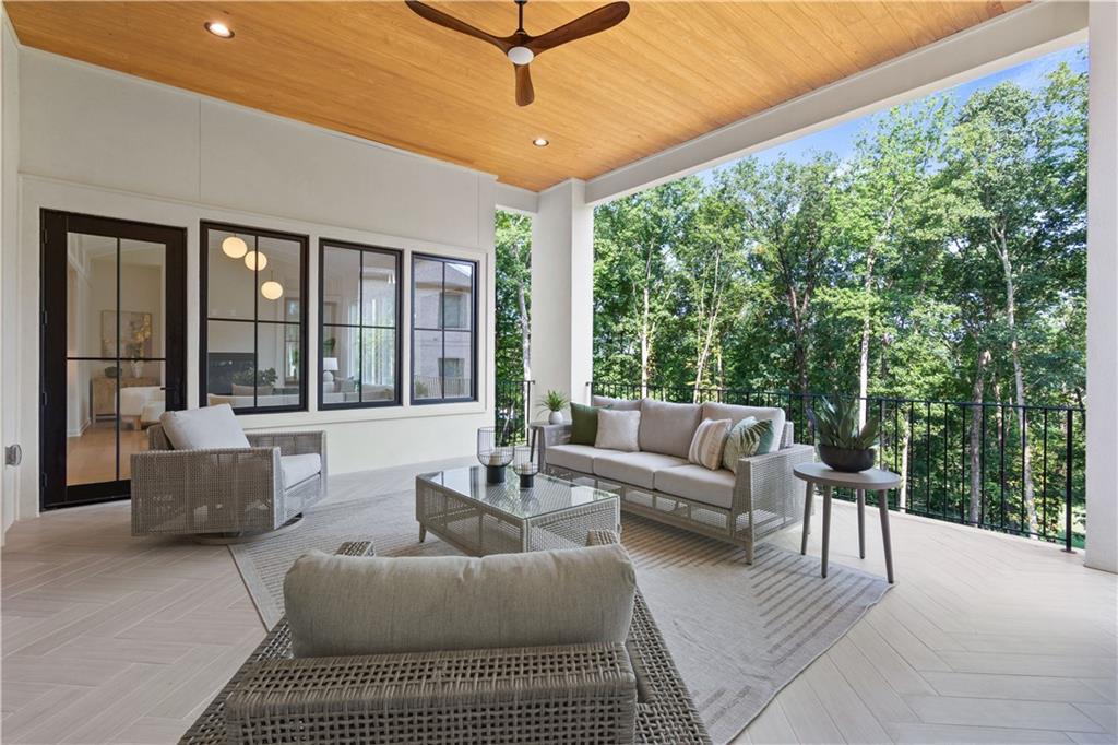 Covered terrace with outdoor living space and wood ceiling detail