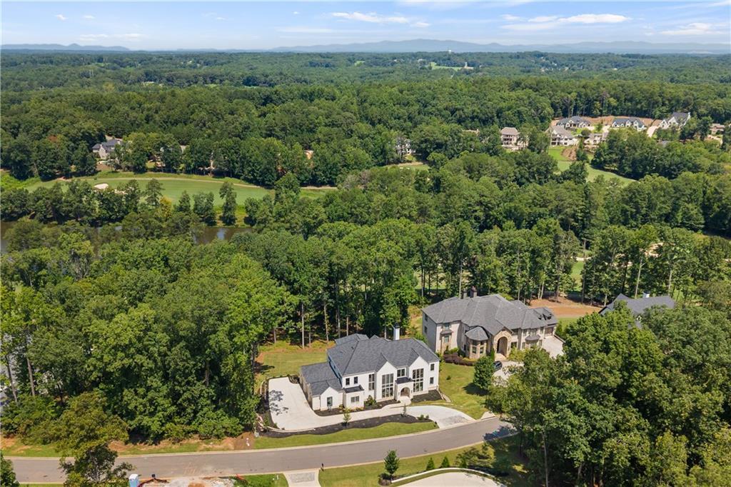 Aerial view of custom estate home and surrounding Echelon golf community in Alpharetta, GA