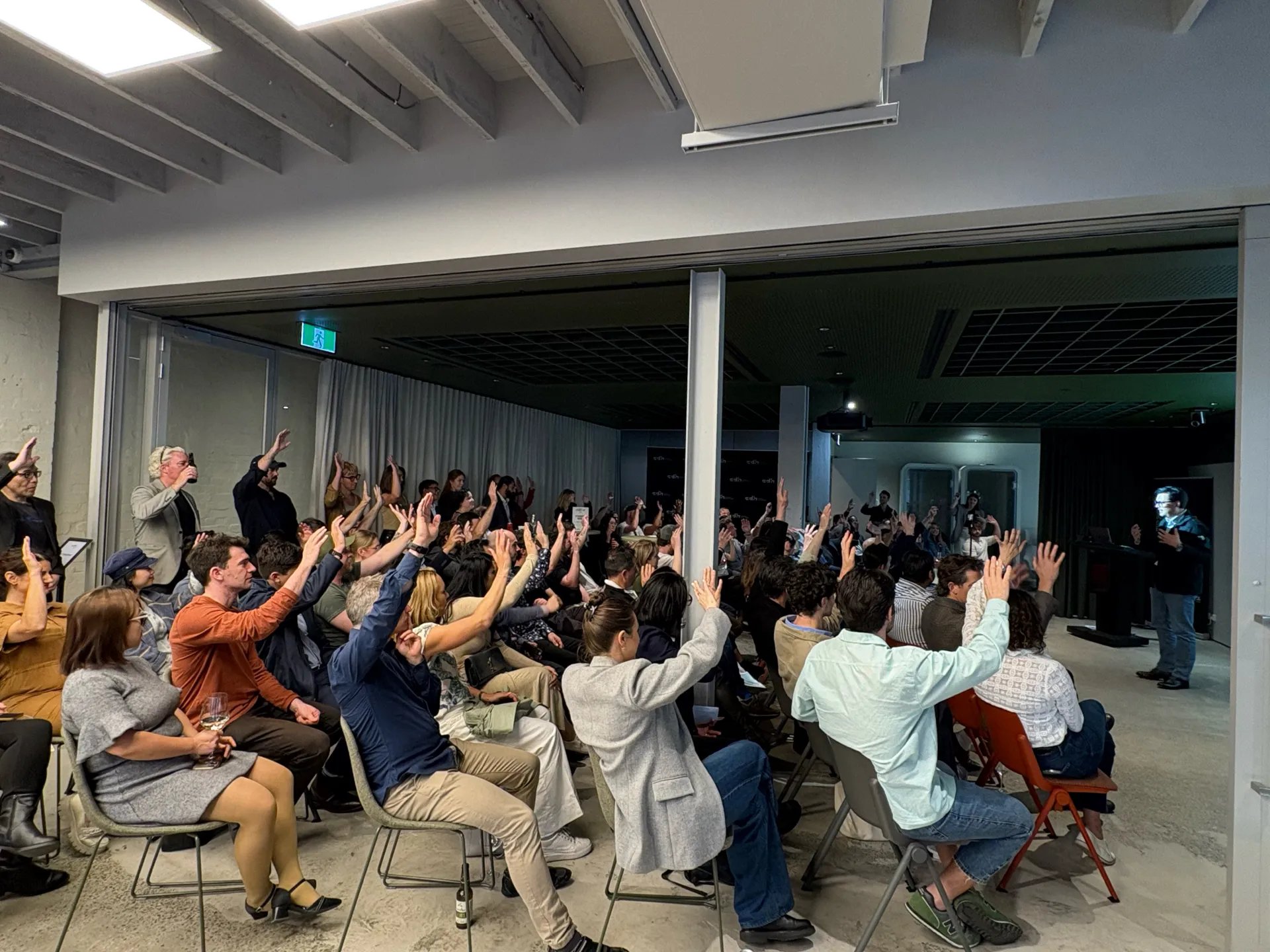 Founders raising their hands at an Aussie Founders Club event