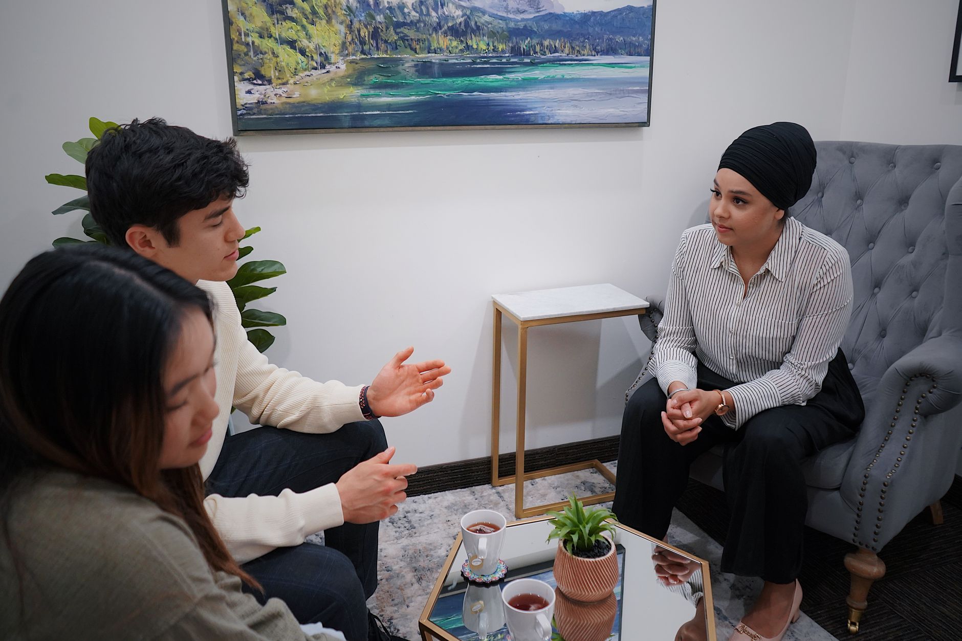 A couple in a consultation session discussing matters in a modern office.