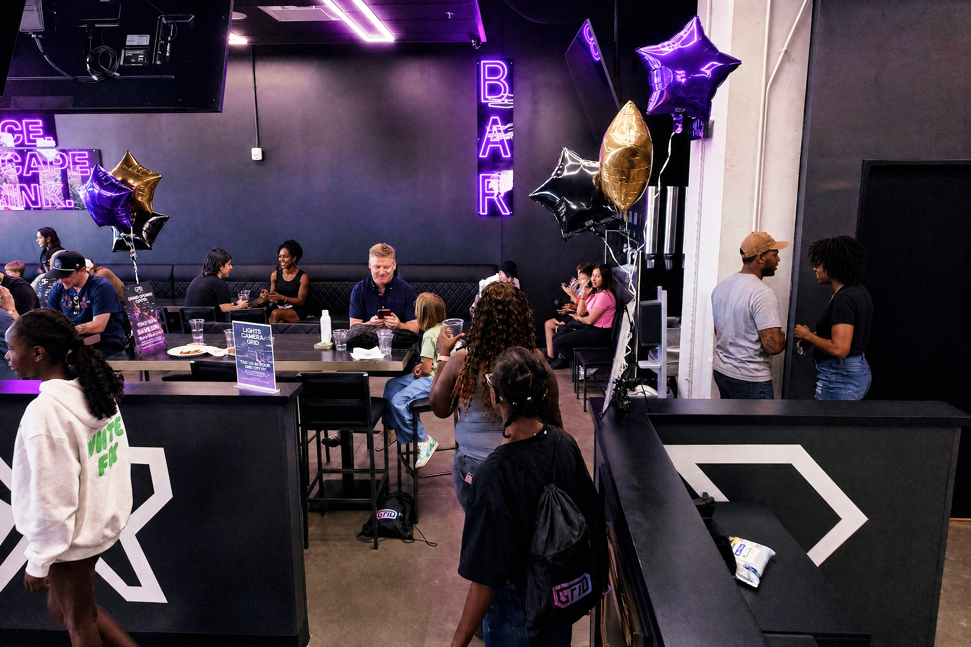 Self-serve tap wall and lounge area at Grid City VR in Westminster, Colorado