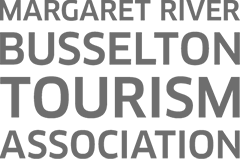 A black and white picture with words "Margaret River Busselton Tourism Association."