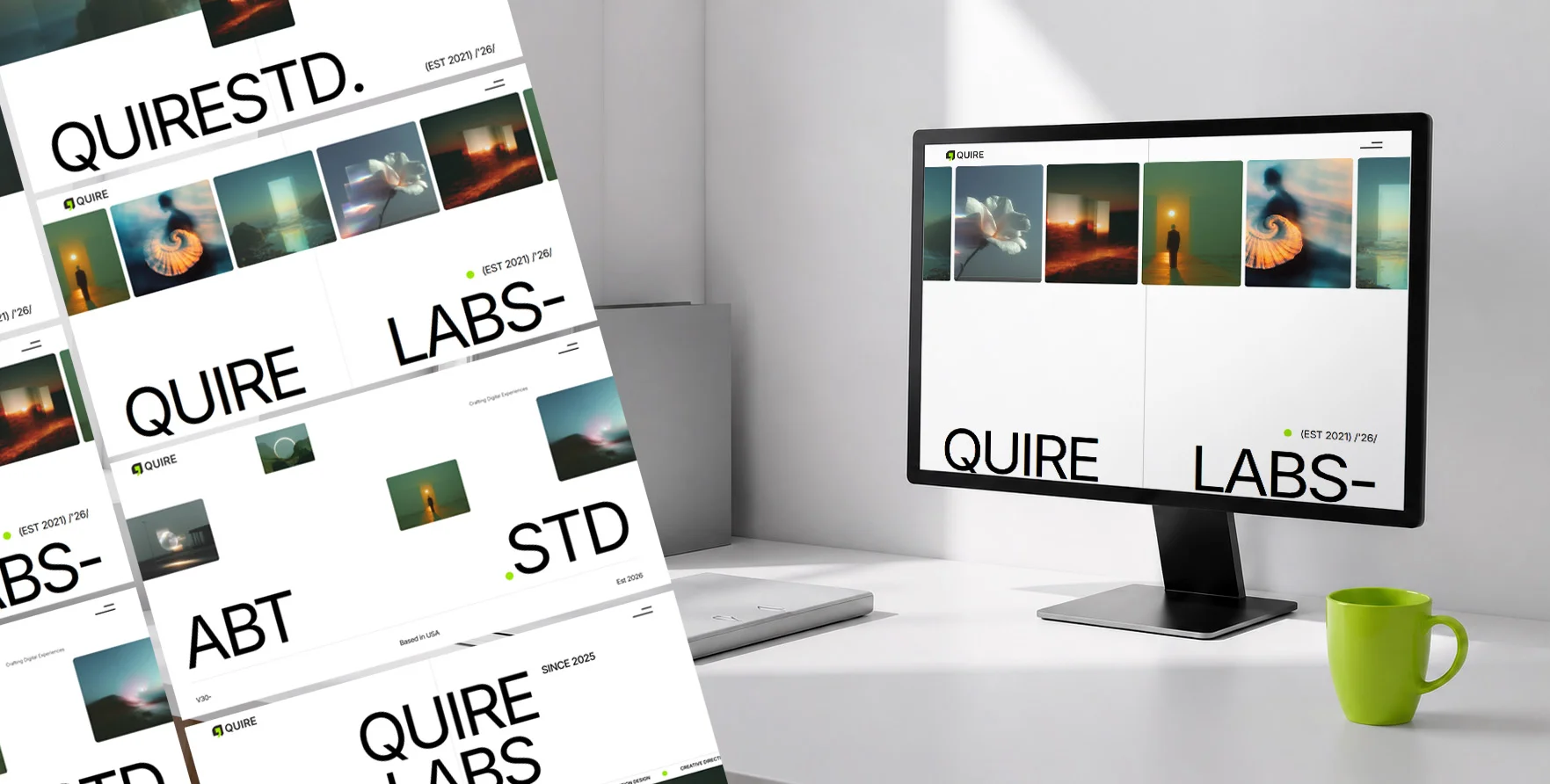 Computer monitor on desk displaying QUIRE LABS website with a green mug and laptop nearby.