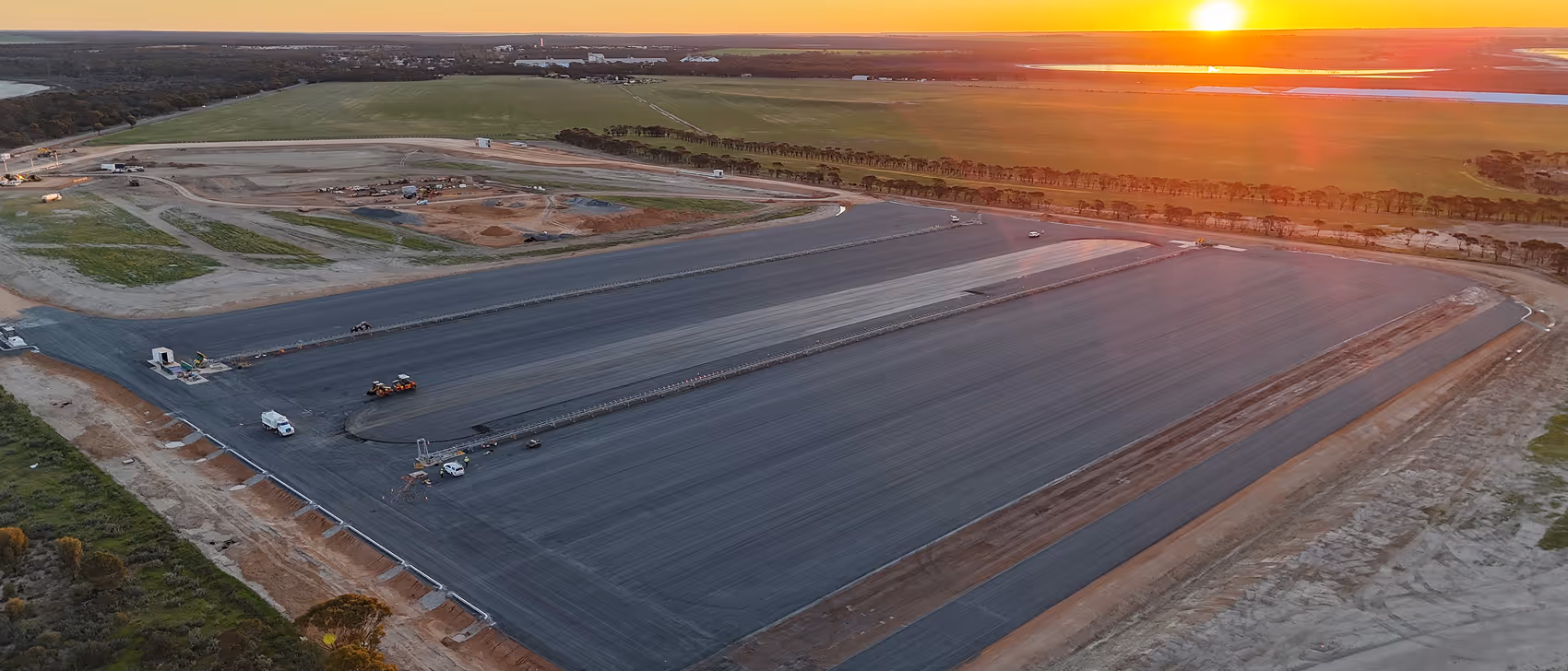Aerial view of road construction and surfacing work in a remote WA landscape representing Roadform Industries.