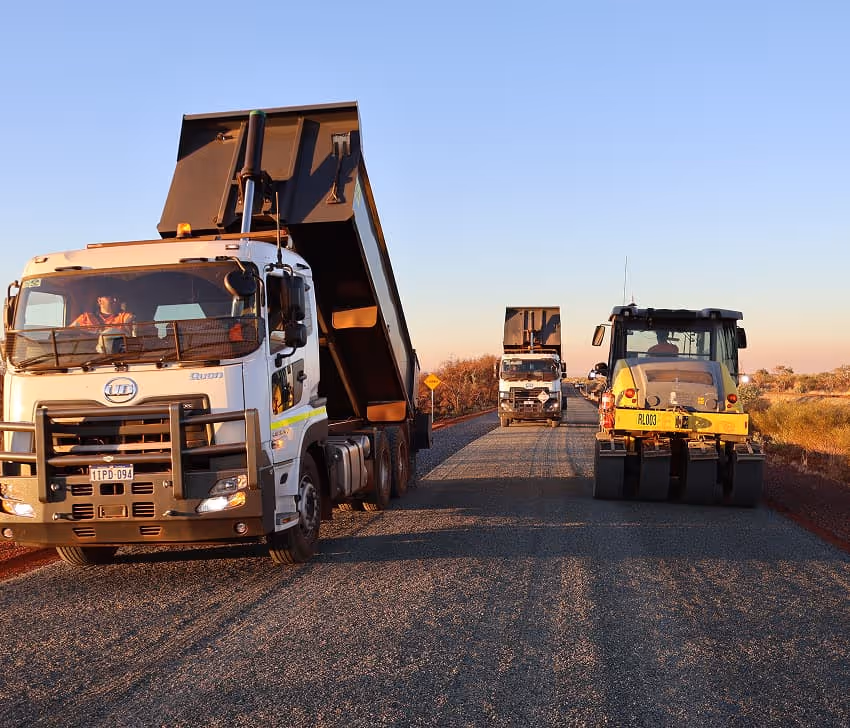 Roadform careers — employee in high-visibility gear operating equipment on a road construction project.