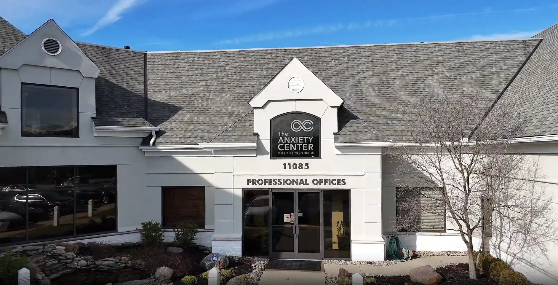 Building front with sign for The Anxiety Center and entrance labeled Professional Offices.