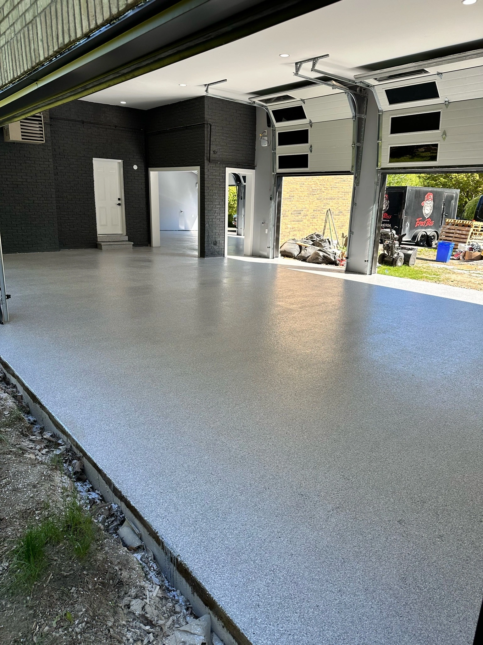 Industrial-grade polyurea crack repair completed on a residential garage floor in Davie Florida.