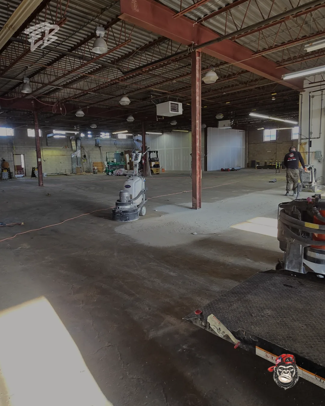 Commercial concrete coating installed across a large warehouse floor in South Florida