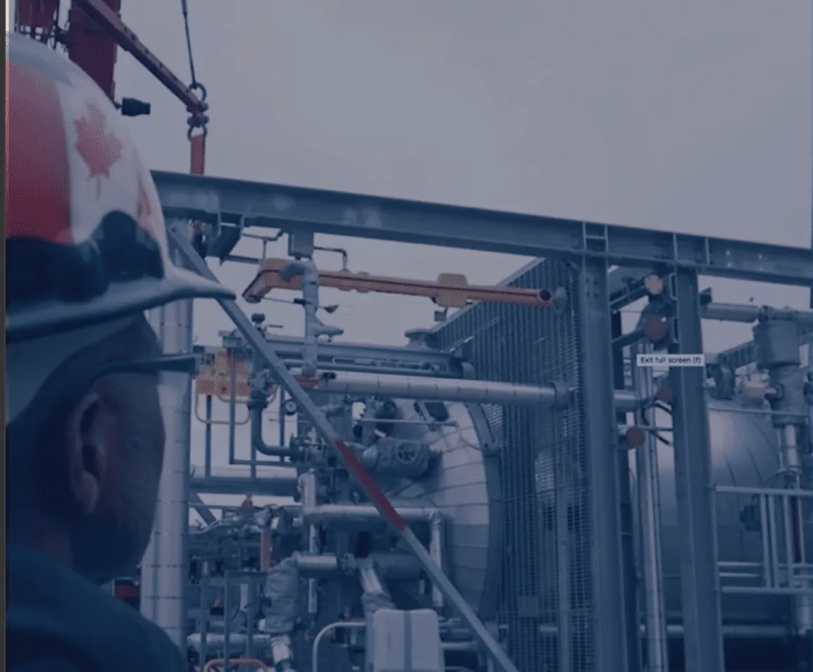 Zeton technician in front of a pilot plant during fabrication