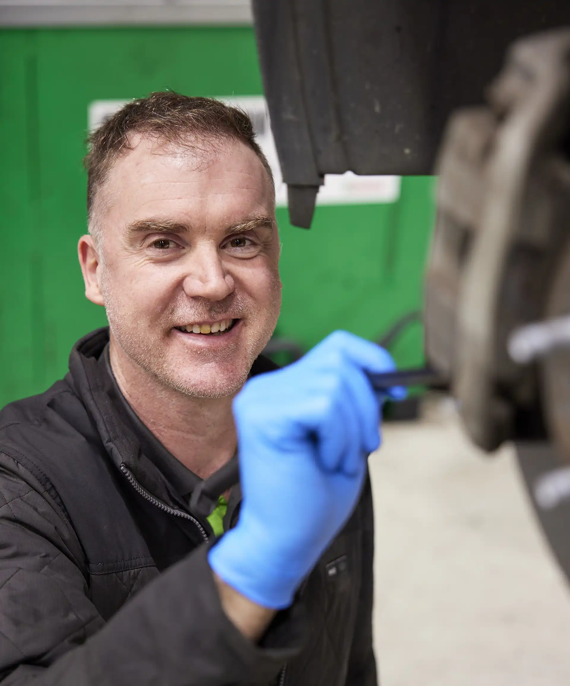 Aussie Tune owner Niegel inspecting brakes on European car