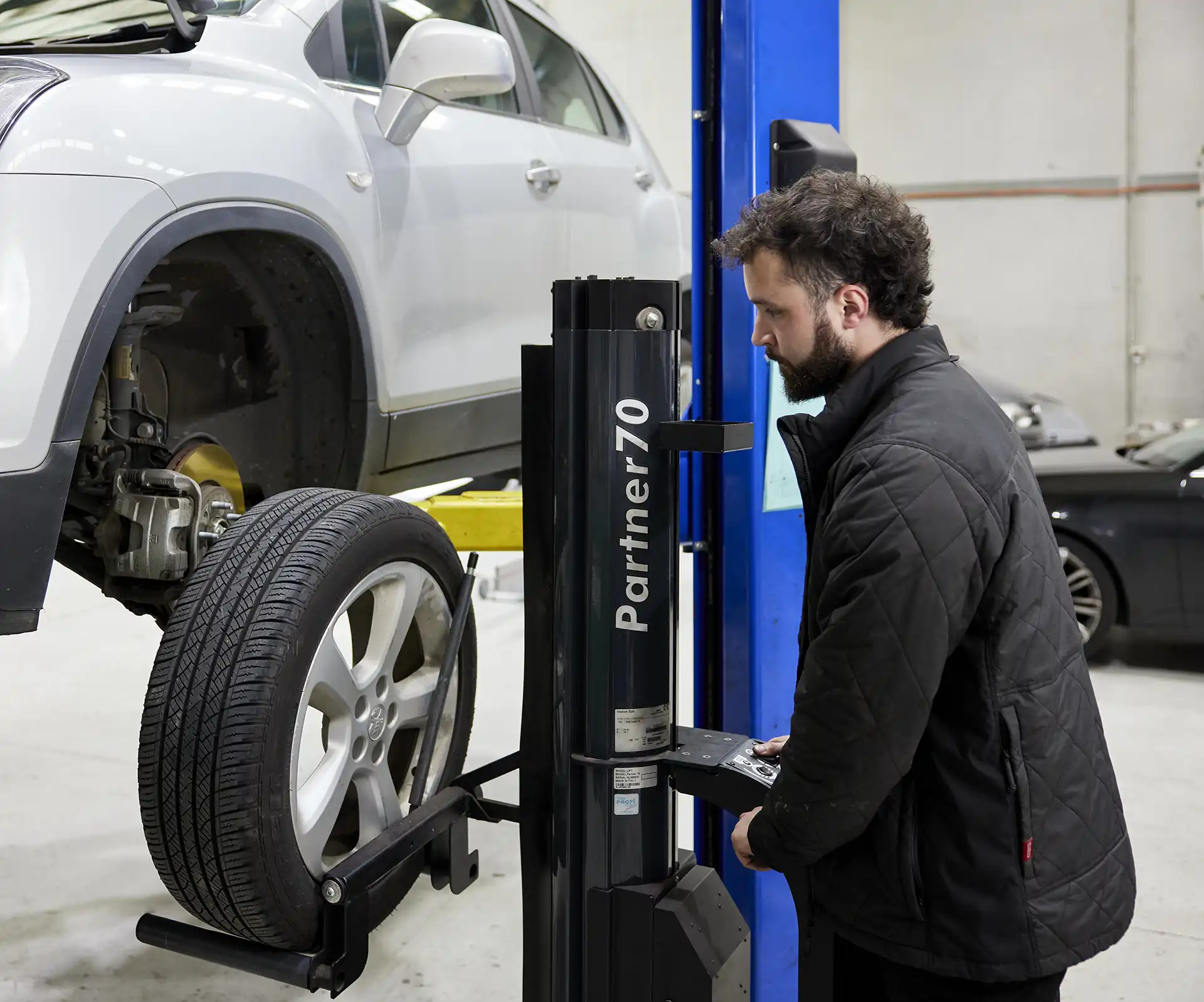 Mechanic inspecting european car at the Aussie Tune workshop near Dandenong
