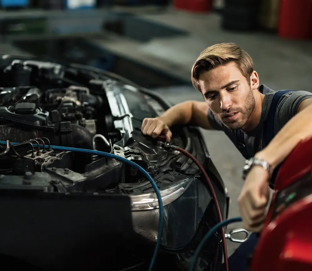 Aussie Tune mechanic repairing air-conditioning system in European car