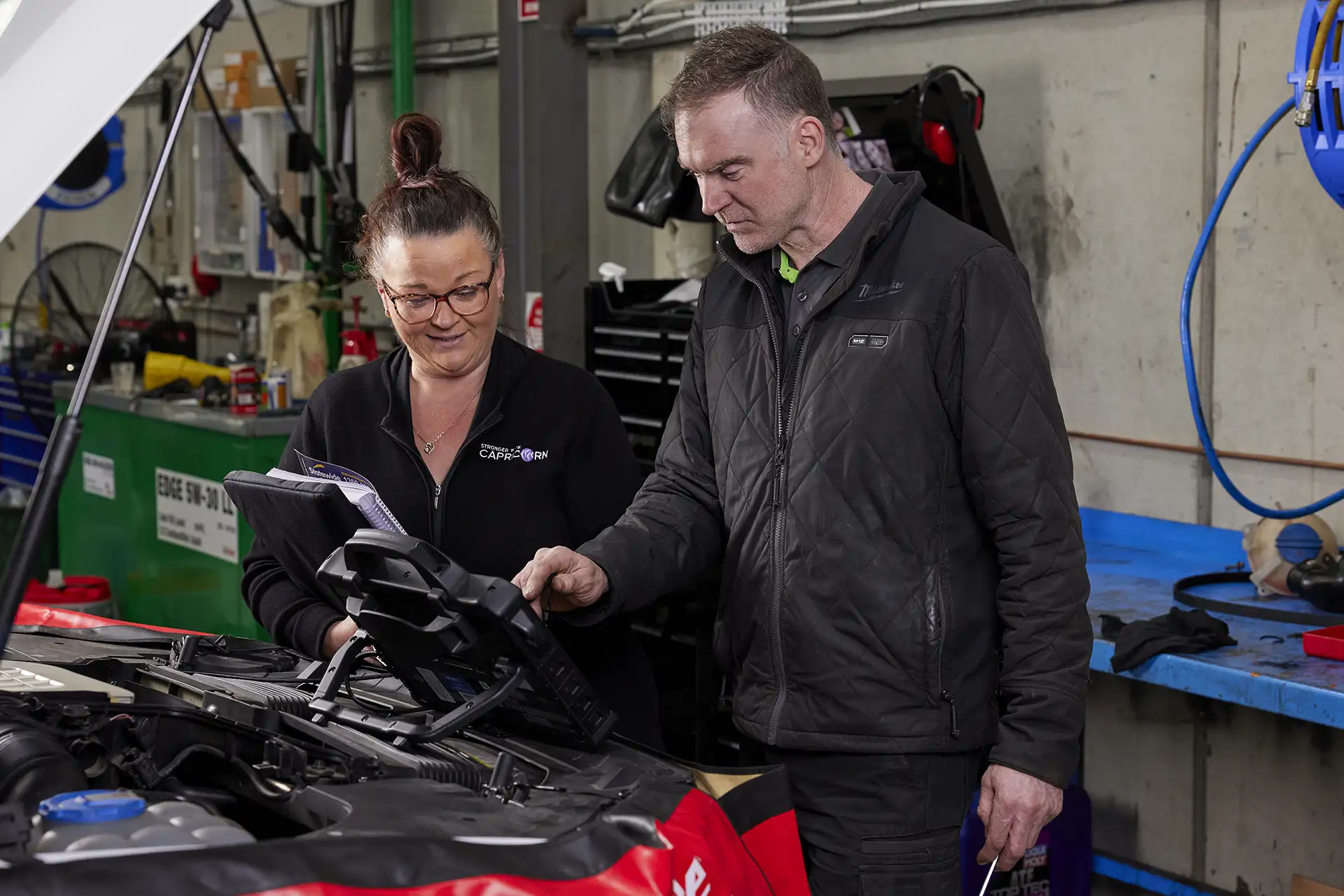 An Aussie Tune mechanic discussing the inspections of a European car the customer is looking to purchase