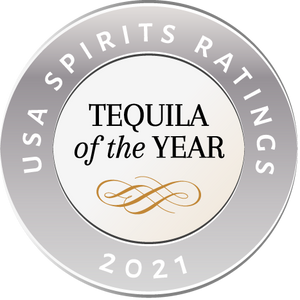 Silver award badge reading 'USA Spirits Ratings 2021 Tequila of the Year' with gold decorative flourish.