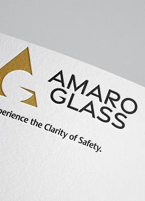 Logo of AMARO GLASS with tagline Experience the Clarity of Safety on textured paper.