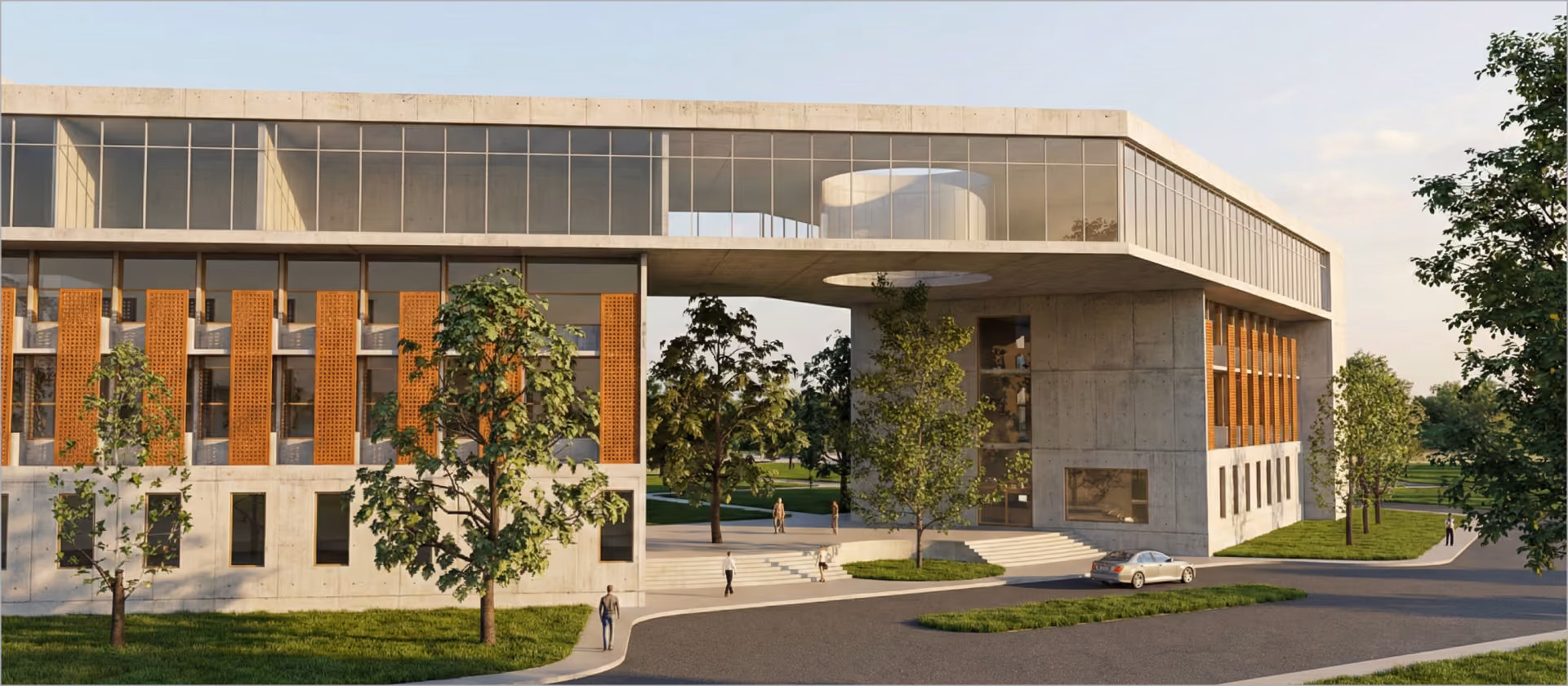 Modern concrete and glass building with orange panels, surrounded by trees and people walking nearby.
