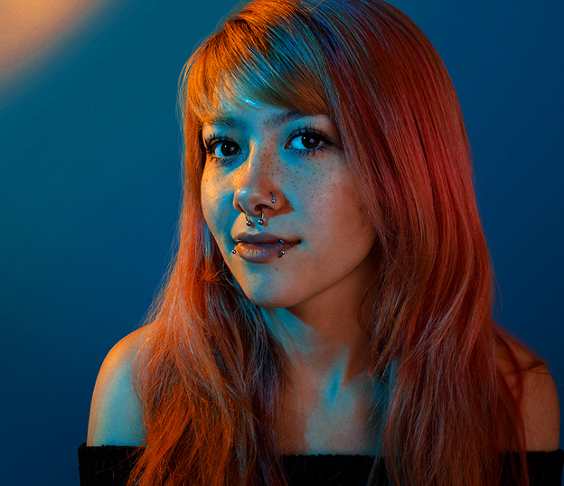 Billboard Music Awards poster with a woman's profile and a vintage microphone on a dark blue background.