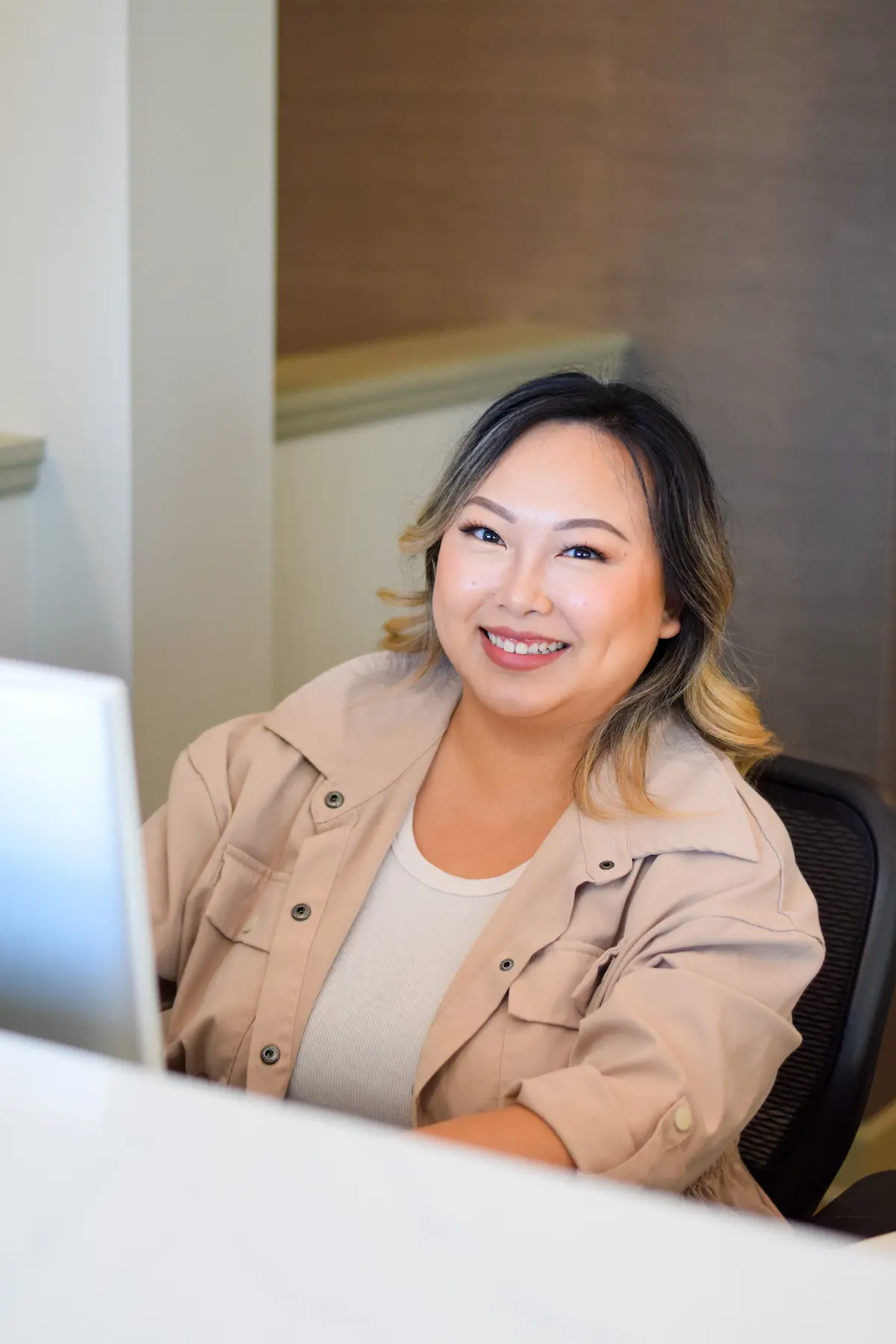Welcoming receptionist at the Maple Grove Office