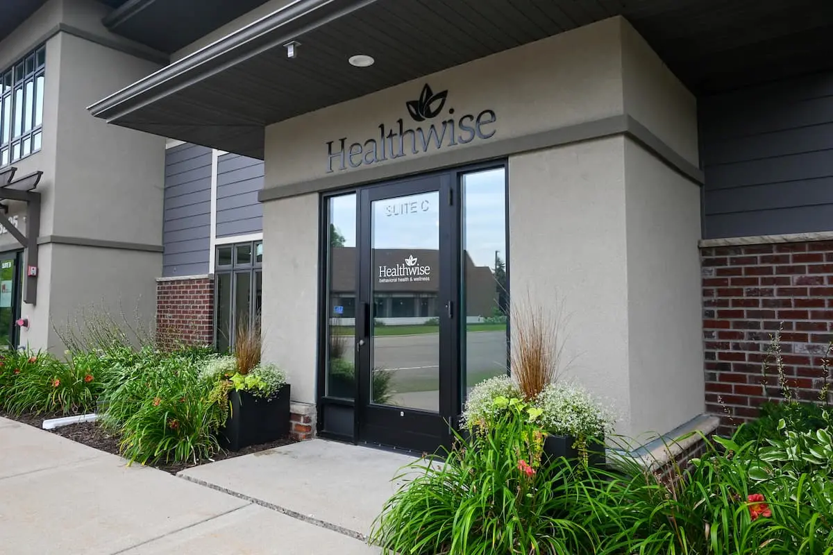 Plymouth office exterior with glass door and landscaping