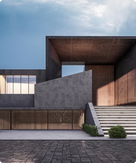 Modern building exterior with gray stone walls, wooden vertical slats, large stairs, and a window under a cloudy sky.