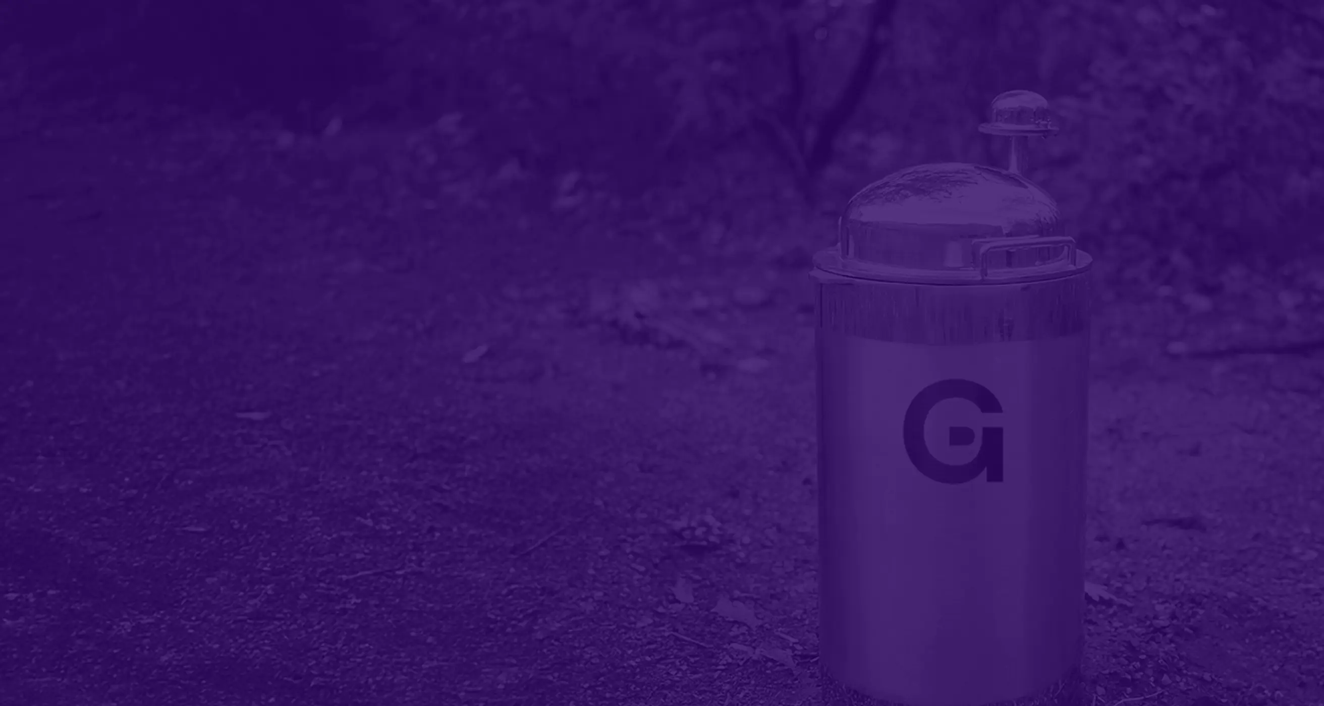 Purple-tinted photo of a Genesys CLAD wellcap installed outdoors
