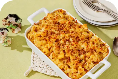Baked macaroni and cheese with a golden breadcrumb topping in a white rectangular dish.