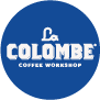 Blue circle with white text reading La Colombe Coffee Workshop logo.