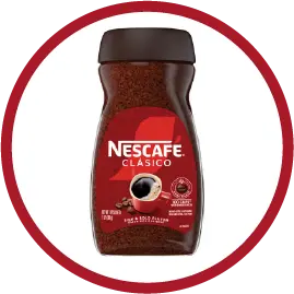 Jar of Nescafé Clasico instant coffee with red label and black lid on white background.