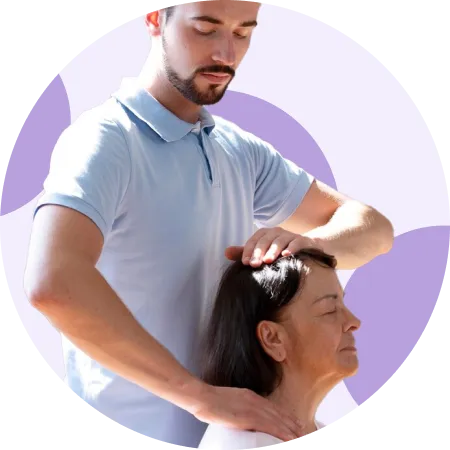 Physical therapist performing a cervical mobilization on an older patient's neck