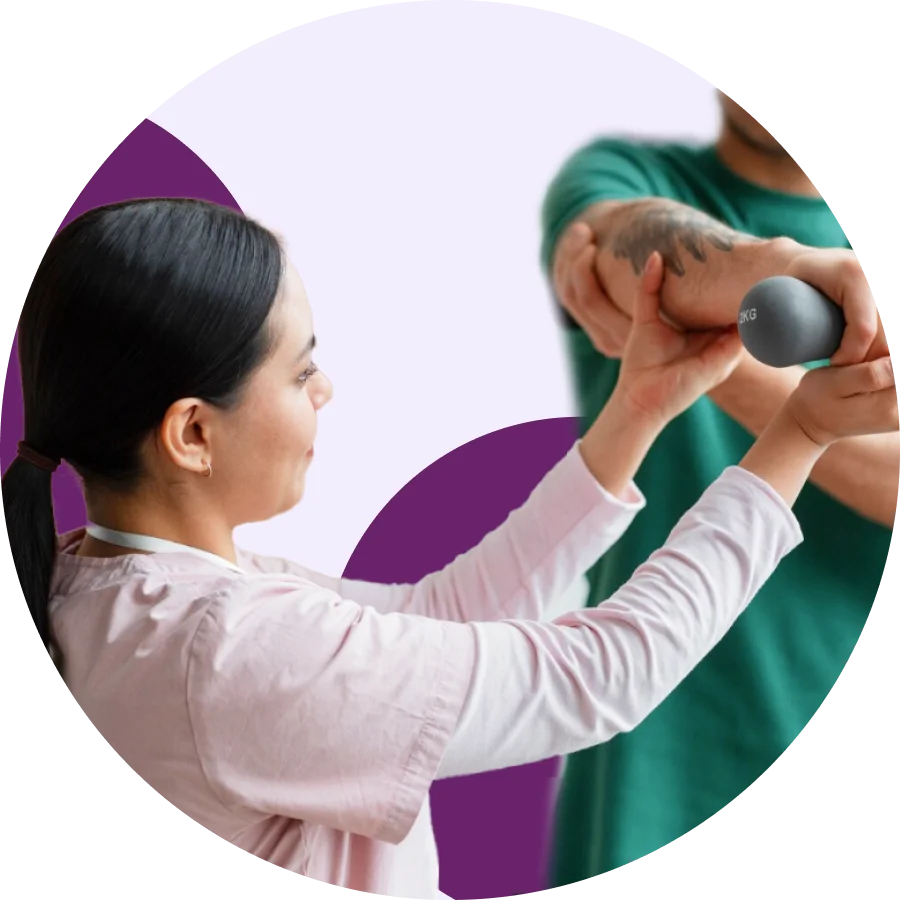 Physical therapist guiding a patient's raised arm as he grips a weighted therapy ball