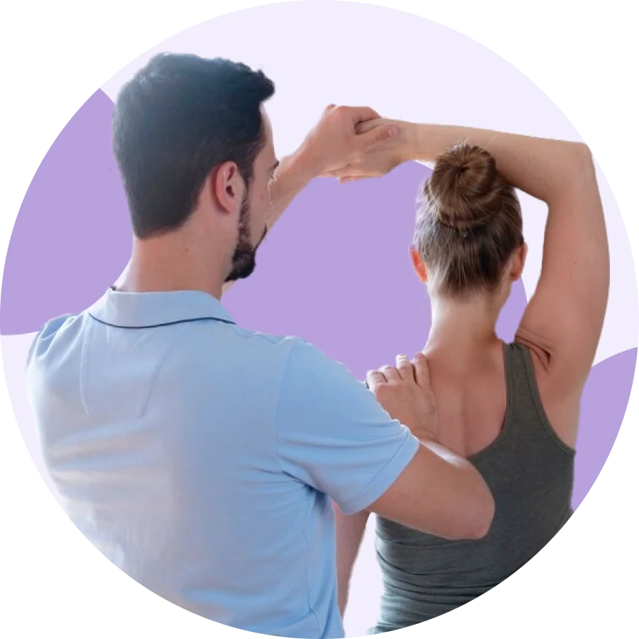Physical therapist supporting a patient's shoulder blade while guiding an overhead triceps stretch