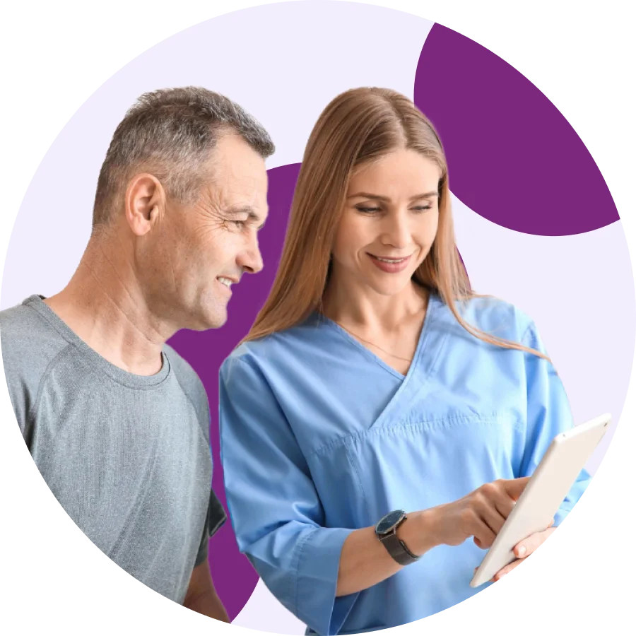 Physical therapist reviewing a treatment plan on a tablet with a patient