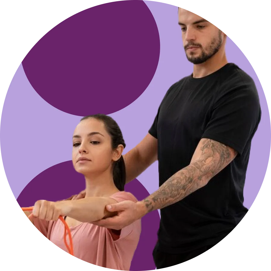 Physical therapist guiding a patient's arm through a resistance band exercise