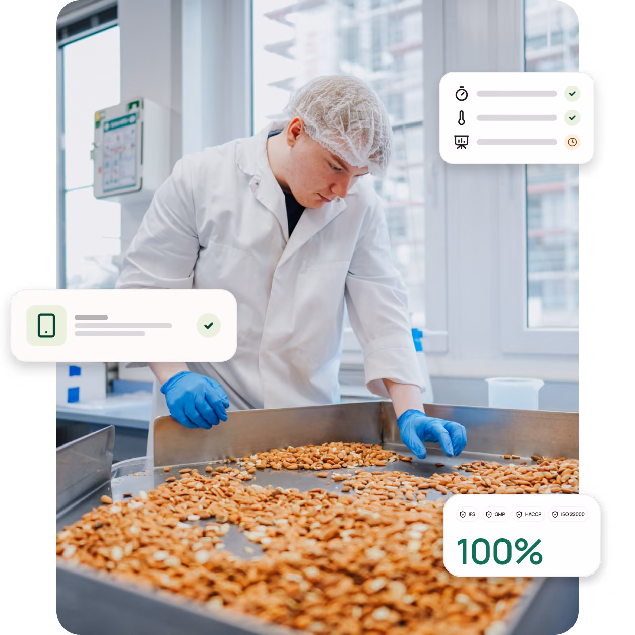 Worker in a lab coat and hairnet inspecting almonds on a conveyor belt in a food processing facility.