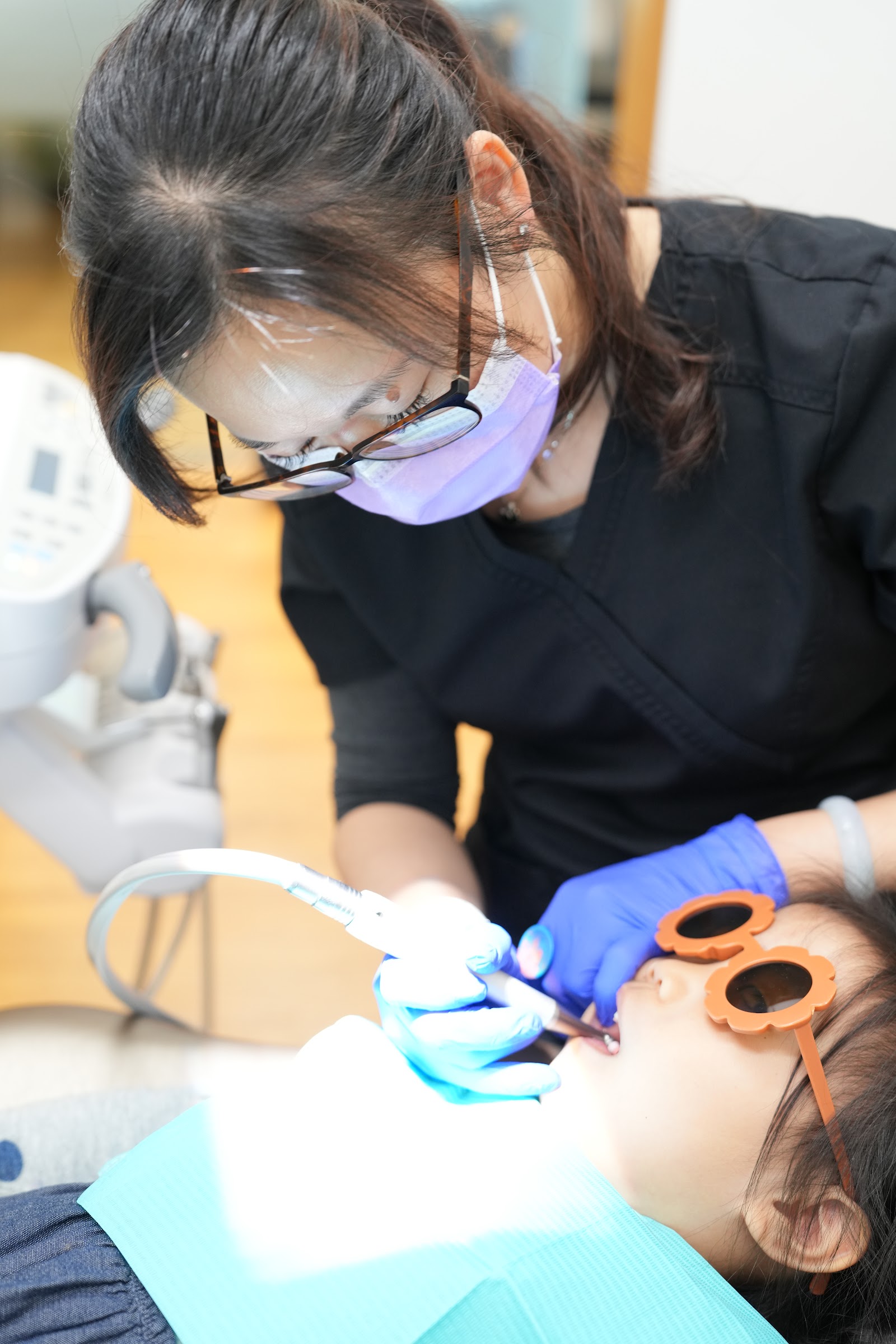 DTC Richmond dentist examining a young patient, demonstrating compassionate and gentle dental care for families
