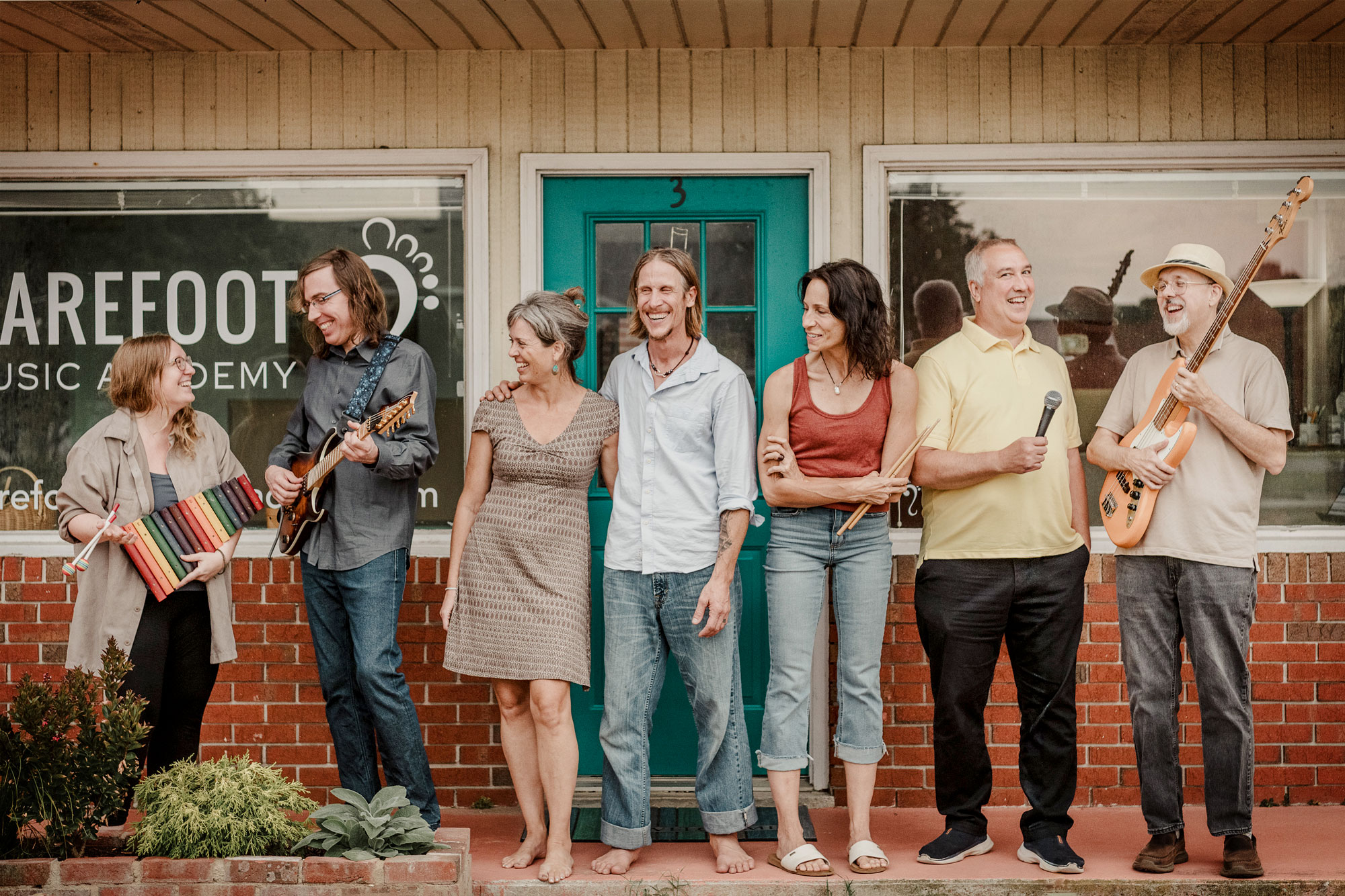 The Barefoot Music Academy team standing in front of the studio