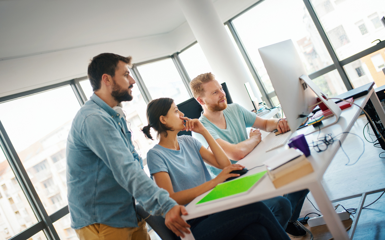 Technology team collaborating in a modern workplace
