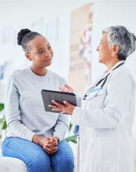Healthcare professional consulting with a patient
