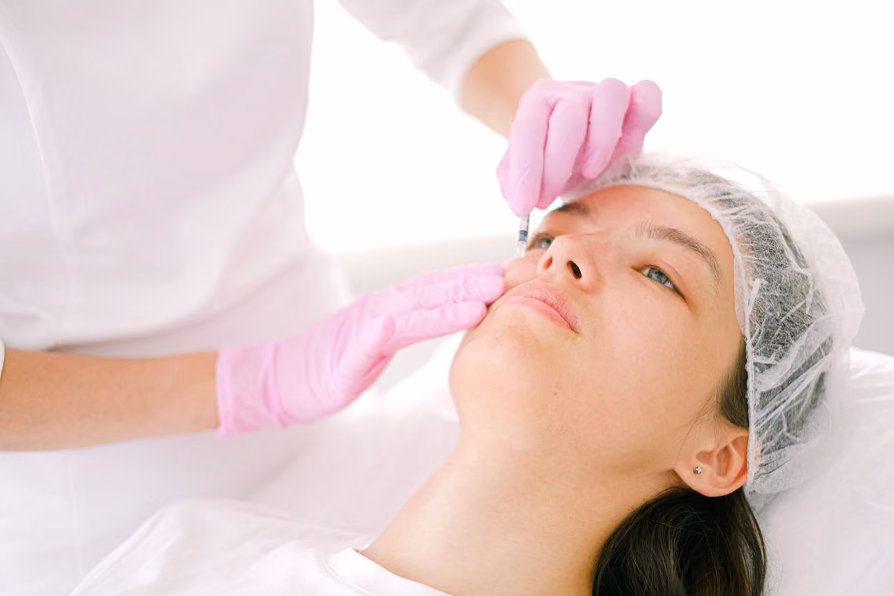Physician performing an anti-aging aesthetic treatment at Unify Care.