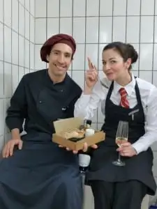 Two colleagues celebrating together at work