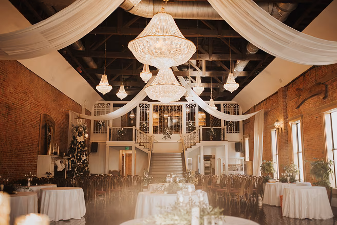 Elegant rehearsal dinner setup at COMFORT in downtown Evansville.